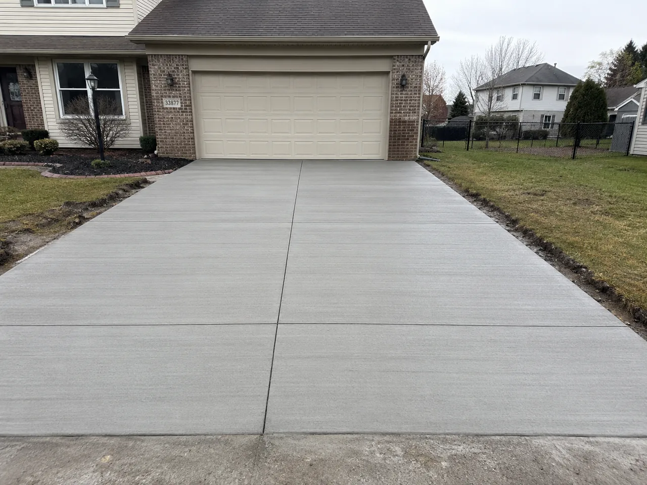 Broom-finish concrete two-car driveway in Livonia, MI