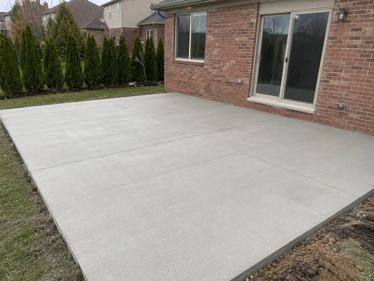 Broom-finish concrete backyard patio in Livonia, MI