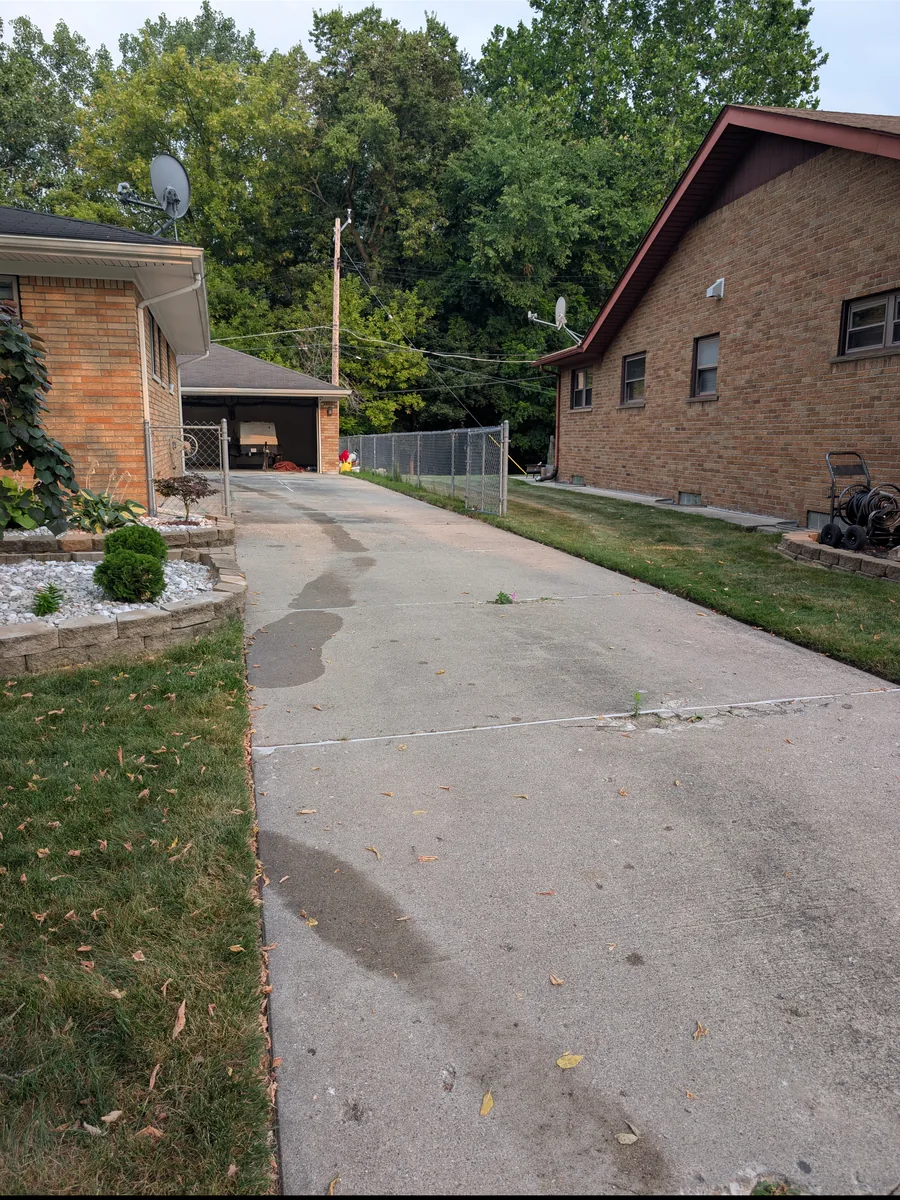 Cracked and patched original concrete driveway before replacement, Dearborn Heights MI