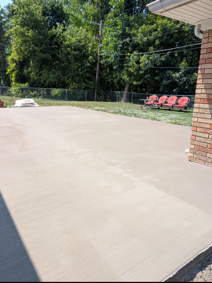 New broom-finish concrete patio replacing brick pavers, Dearborn Heights MI