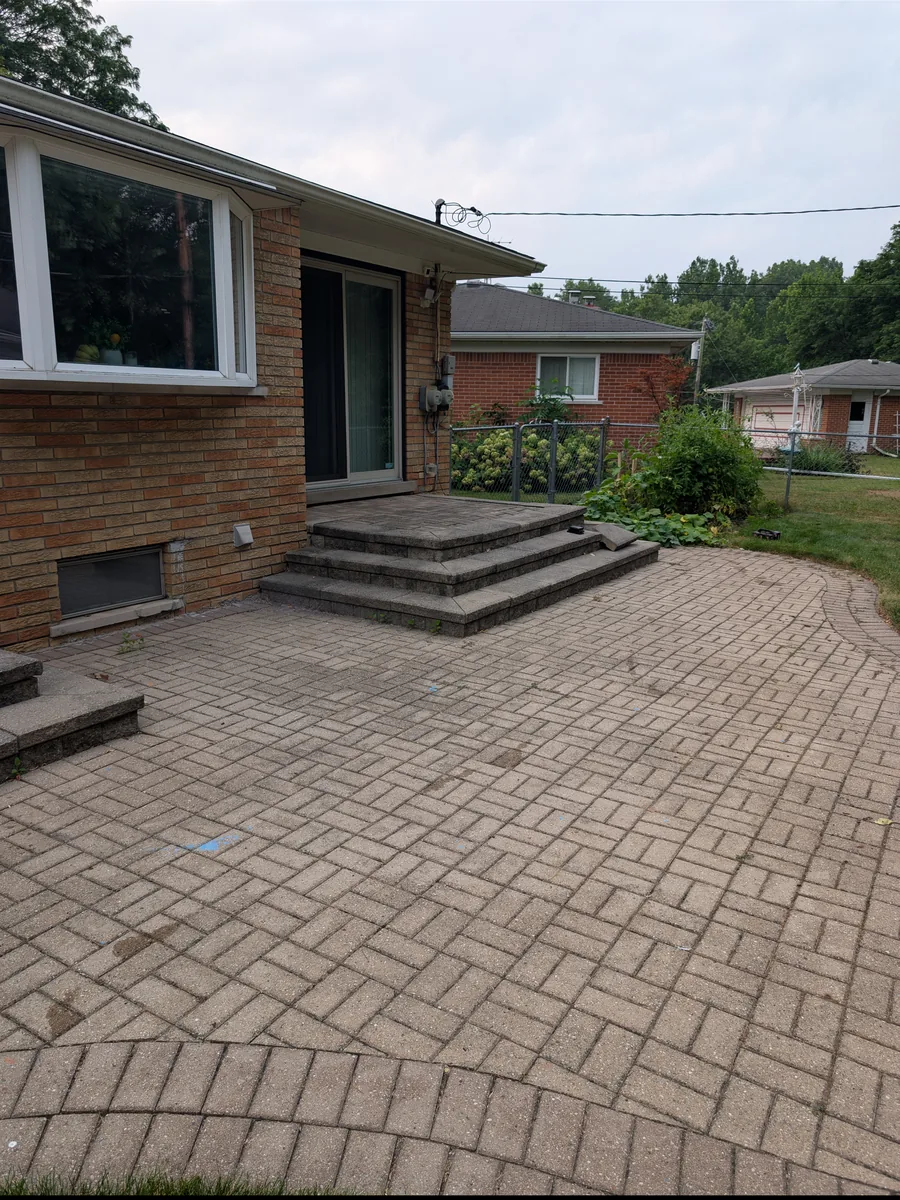 Old brick paver patio with block steps before removal, Dearborn Heights MI