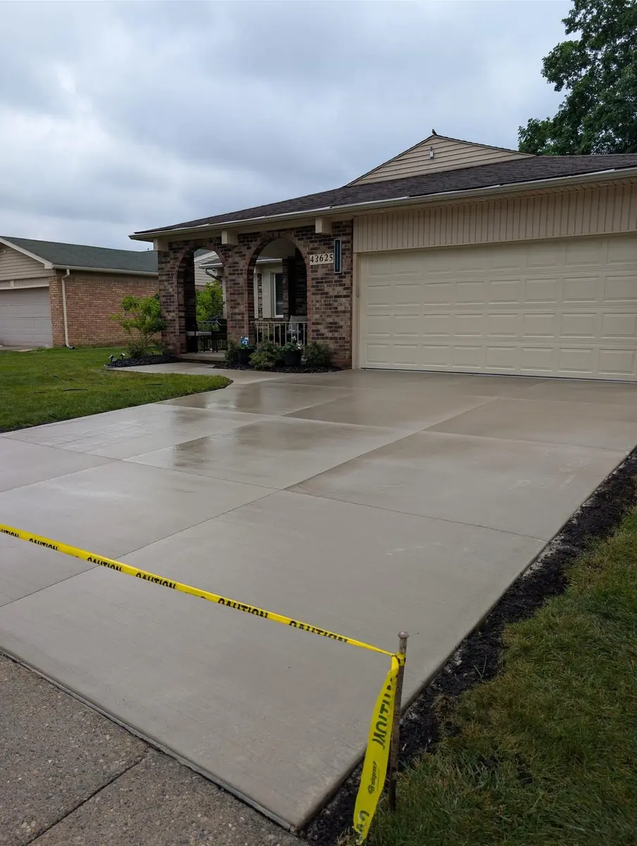 Broom finish concrete driveway replacement in Canton, MI