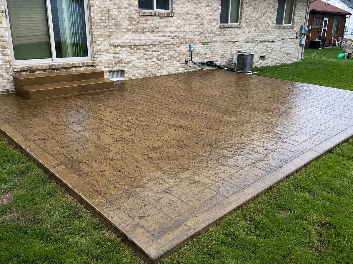 Brick pattern stamped concrete patio with steps in Garden City, MI
