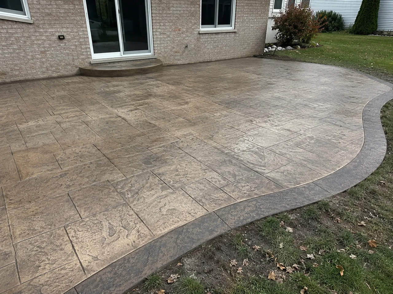 Stamped concrete patio with ashlar slate pattern in Livonia, MI